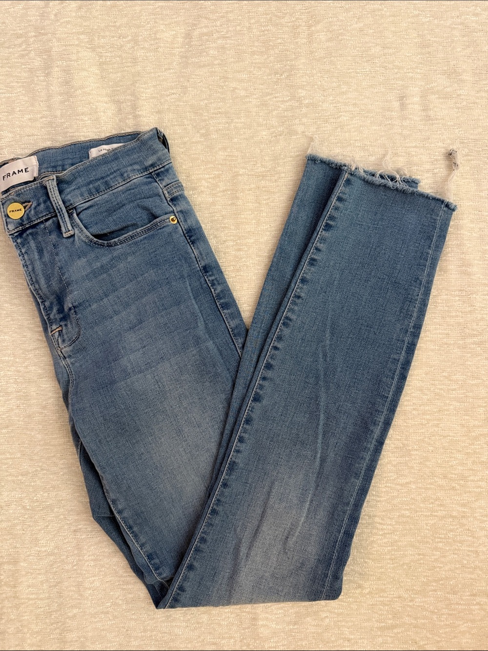 Frame Denim Light Blue High-Rise Skinny Jeans with Frayed Hem